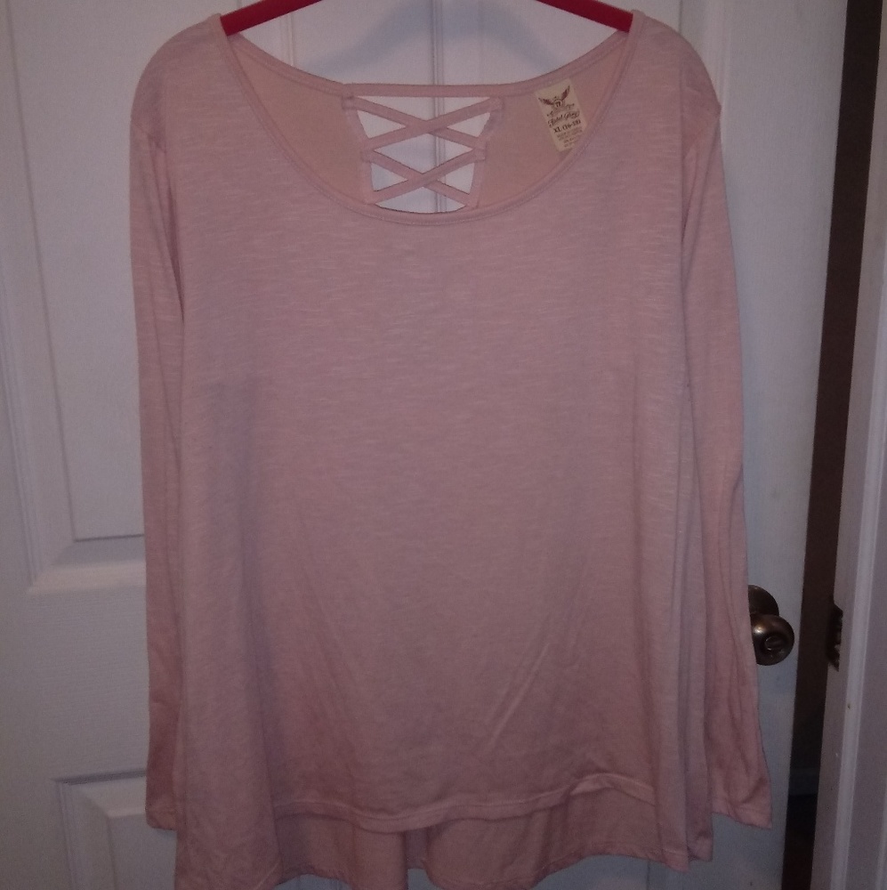 Half back crossed long sleeve light pink shirt.